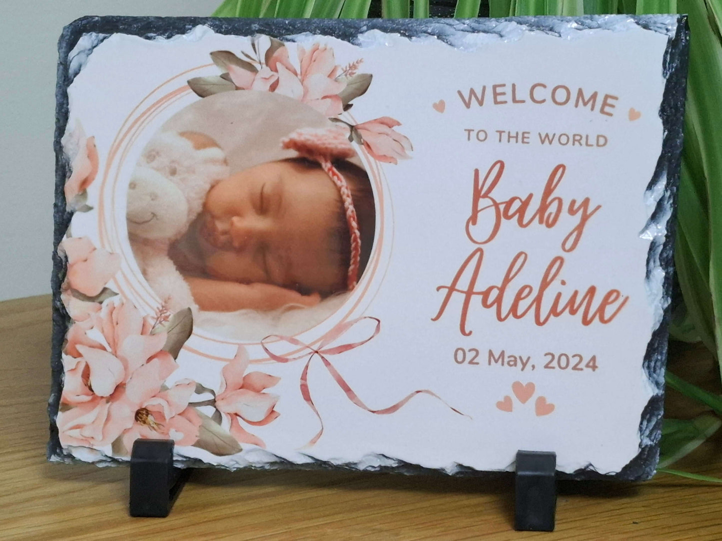 Personalised baby photo slate showcasing a newborn with floral design, perfect for celebrating new life and cherished memories.