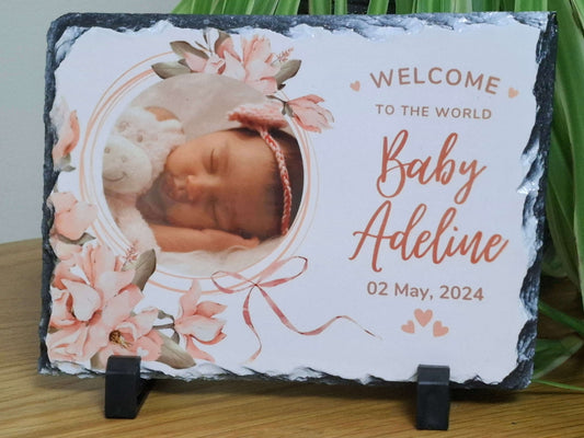 Personalised baby photo slate showcasing a newborn with floral design, perfect for celebrating new life and cherished memories.